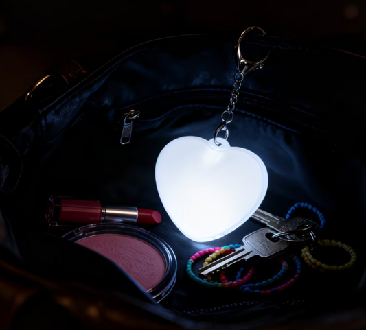Heart Glow Pendant Light glowing inside a dark handbag